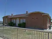 The Old Rittenhouse Elementary School, located on the S.E. corner of Ellsworth and Queen Creek roads was built in 1925. Used as a school through 1982, this building now houses the San Tan Historical Society. Listed in the National Register of Historic Places in 1998. Reference 98000053