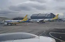 [[Cebu Pacific]]'s  A330-900neo (right) and A320neo (left) parked at [[Ninoy Aquino International Airport]].