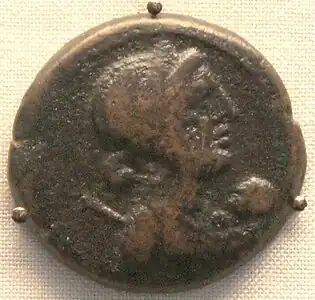 A coin depicting Cleopatra VII with her son Caesarion as an infant, British museum.