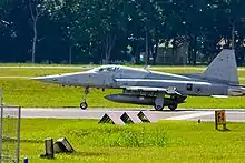 An F-5S of 144 Squadron preparing for take-off.