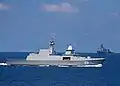 RSS Intrepid and USS Harpers Ferry transits in the background during maneuvers in the Singapore phase of Cooperation Afloat Readiness and Training (CARAT) 2009.