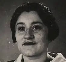 Black and white headshot of a black-haired woman