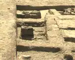 Archaeological site with remains of structures