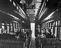 Railroad workers inside the car for a service.