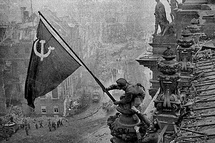 Raising a Flag over the Reichstag, by Yevgeny Khaldei, 2 May 1945