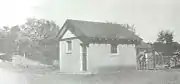 The small barn next to a horse corral (1930s).