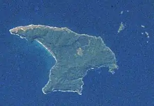 View taken from an orbiting spacecraft showing a roughly triangular-shaped island