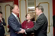 President Ronald Reagan and Nancy Reagan greet Billy Graham at the National Prayer Breakfast held at the Washington Hilton, 1981.