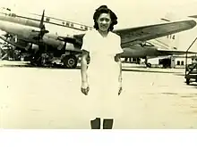 Rebecca Chan Chung at Longhua Airport, in front of a CNAC Curtiss C-46 (c.1947)