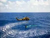 HUS-1 helicopter from USS Lake Champlain recovering Alan Shepard from the Freedom 7 capsule