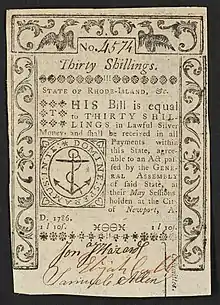 A 1786 Rhode Island bank note featuring the Rhode Island seal with the inscription:  "STATE OF RHODE-ISLAND, &c. THIS Bill is equal to THIRTY SHILLINGS in Lawful Silver Money, and shall be received in all Payments within this State, agreeable to an Act passed by the GENERAL ASSEMBLY of said State, at their May Sessions, holden at the City of Newport, A. D. 1786. 1l 10s." ; "Committee" is written vertically, to the right of the signatures. ; Within seal: "DOMINE: SPERAMUS: IN: TE:" ; Verso: "One Pound Ten. Printed by SOUTHWICK and BARBER. Death to Counterfeit."