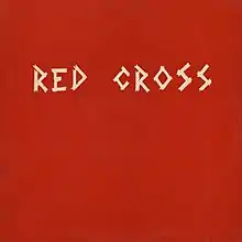 The cover art of the Red Cross EP, referred as "the red cover", shows the band's name on a red background, written, with its original spelling, in uppercase white letters resembling strips of medical tape.