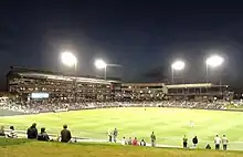 Baseball stadium at night from center field.