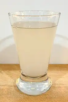 Photo of a glass misty coloured liquid