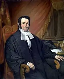 Colour painting of a fair-skinned man with dark hair, seated, wearing English court garb