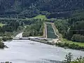 Rottau equalizing basin. Right: the Oberwasser channel, that leads to Möll Valley Power Station. Left: the natural river bed though which only a fraction of the water flows.