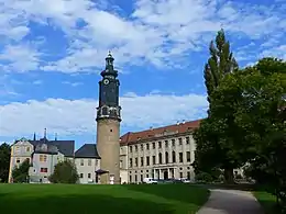 A residential palace with a tall clock tower