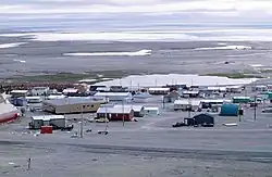 Resolute in August 1997. Visible on the left is a long school building (brown).