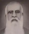 Priest with a long, white beard