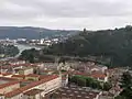 Château de la Batie on Mont Salomon towers over the Rhône and Estressin (north Vienne) with Collège Ponsard in the foreground