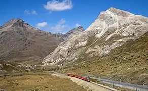 An RhB Regio train to Tirano between Lagalb and Ospizio Bernina.