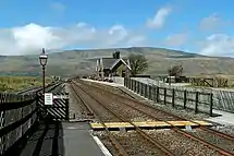 The station at Ribblehead is located to the south of the Ribblehead Viaduct.