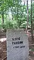 Site of Rice Tavern, a former colonial tavern with the foundation in back of the sign, near the entrance at Old Marlboro Road in Maynard