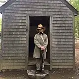 Costumed Thoreau interpreter Richard Smith at Thoreau replica cabin