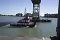 A boat passes under the Rio Vista Bridge