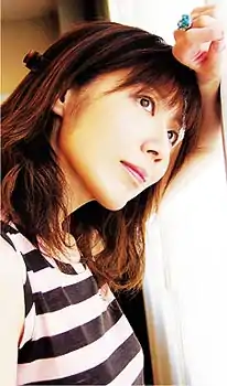 Okazaki on the cover of her album Love & Life (2005).