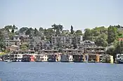 Along the waterline, the two-story floating homes of Roanoke Reef, seen here from Gas Works Park, have replaced the more modest structures in the previous image.