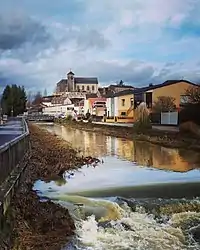 The Church, located on the hill known as "Le Rocher" in central Hettange-Grande, seen from the river Kissel