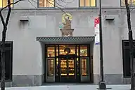 Saint Francis of Assisi decoration over the entrance at 9 West 50th Street