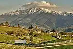 Mounains and some old houses in front