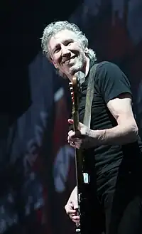 Roger Waters playing bass and singing