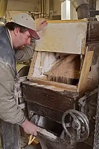 Roll Stand in Roller Mill with mill worker.