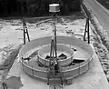 A NASA engineer takes a walk in simulated zero gravity around a mock-up of a full-scale, 7.3 m (24 ft) diameter space station in 1964.