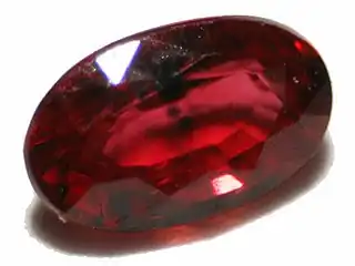 Natural ruby with inclusions