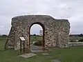 Battered buttresses reinforce this wall.