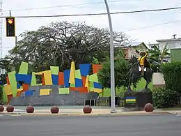 "Hatillo Mask Festival" statue located at downtown entrance