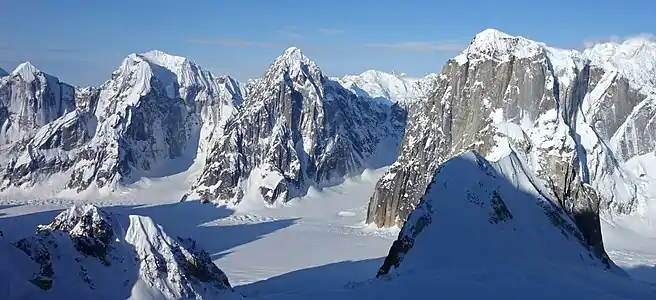 Left to right: Mount Johnson, Mount Wake, Mount Bradley, and Mount Dickey seen from the Moose's Tooth area