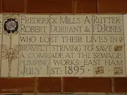 A tablet formed of five tiles of varying sizes, bordered by yellow and blue flowers in an art nouveau style