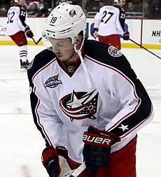 Ryan Johansen in a white away Columbus Blue Jackets jersey and white helmet, holding his hockey stick