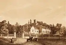 A pencil-and-watercolor drawing of a small village. Several two-story buildings sit around a crossroad junction.