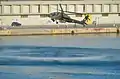 An AH-64 Apache of the Hellenic Army Aviation flying a few meters above the sea level in the harbour of Kavala (2013 AirSea Show)