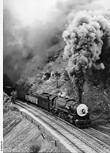 Image 6500 class engine No.502 hauling a freight train in at Eden Hills, August 1953. (from Transport in South Australia)