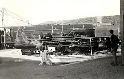 NBL-built no. 3411 relieving electric units on a northbound Trans-Karoo at Beaufort West, Cape Province, 26 June 1966