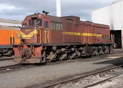 No. 35–467 in SAR Gulf Red and yellow whiskers livery, Bellville loco depot, Cape Town, 24 May 2009