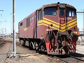 No. E1592 in SAR Gulf Red & yellow whiskers livery at Bellville Depot, Cape Town, 21 October 2009