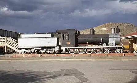 Class 7BS no. 1056 with a 6½ ton coal capacity Type ZC tender, plinthed at Burgersdorp, 8 April 1978 - note chimney location